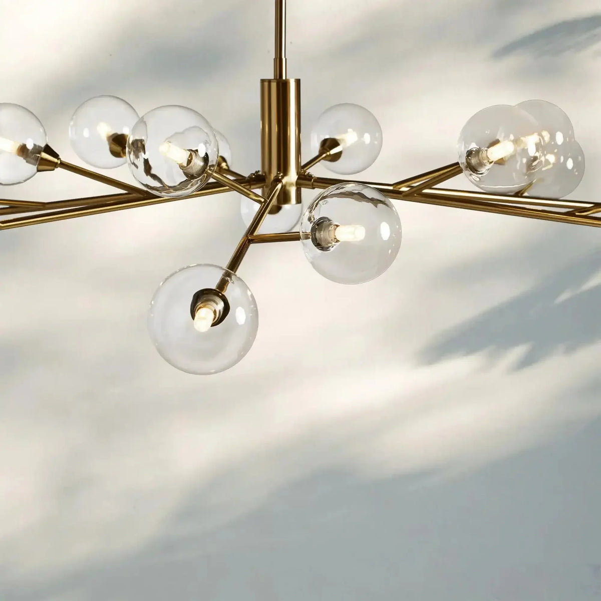 Apollo Round Midcentury Modern Starburst Chandelier in Antiqued Finishes