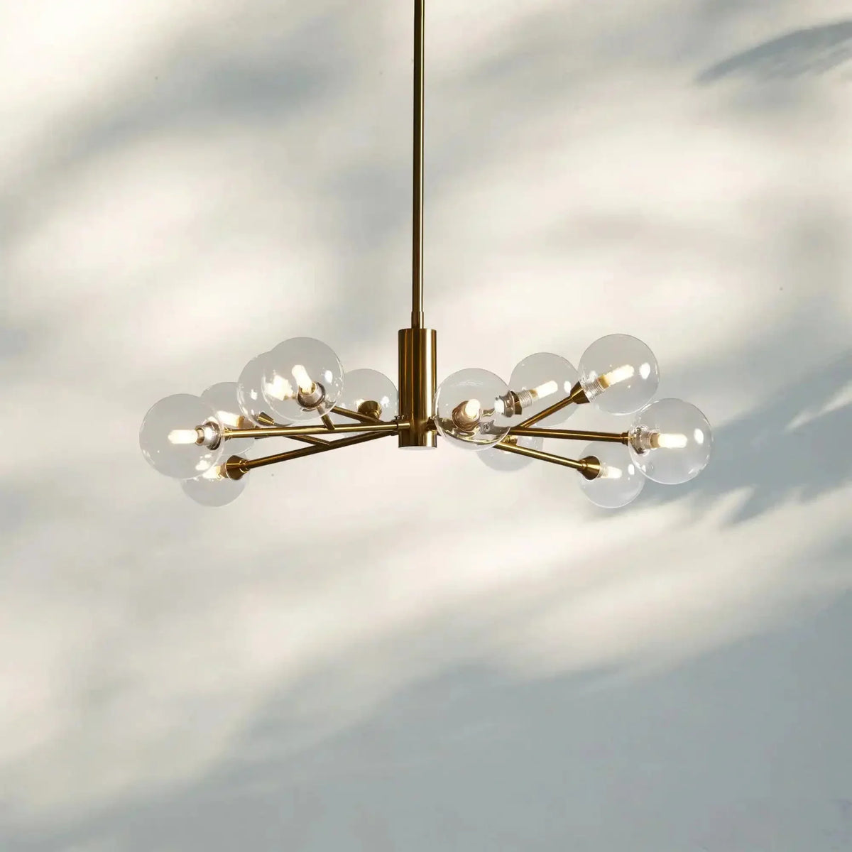 Apollo Round Midcentury Modern Starburst Chandelier in Antiqued Finishes