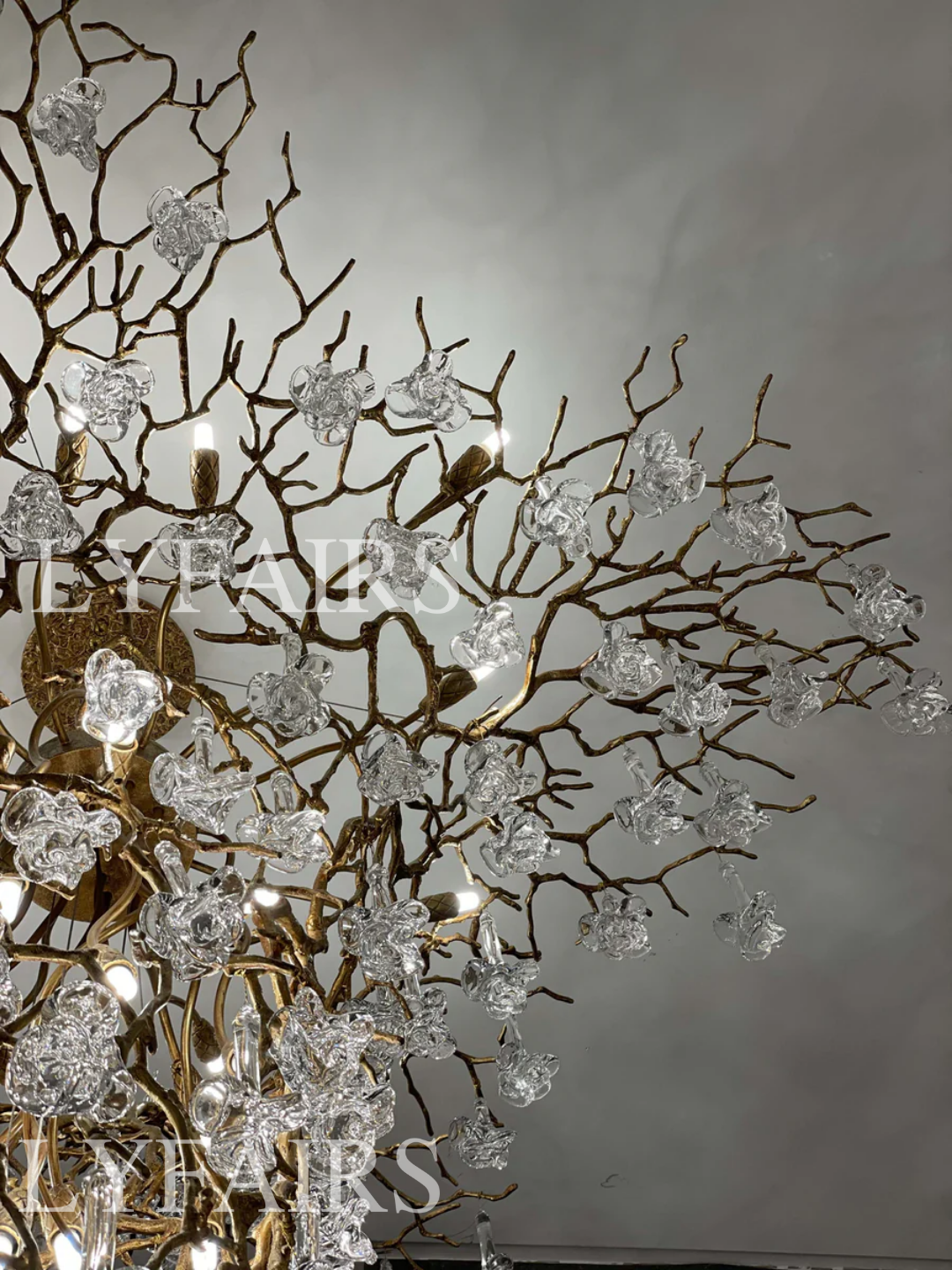 Nature-inspired Brass Tree Chandelier with Glazed Glass Flowers