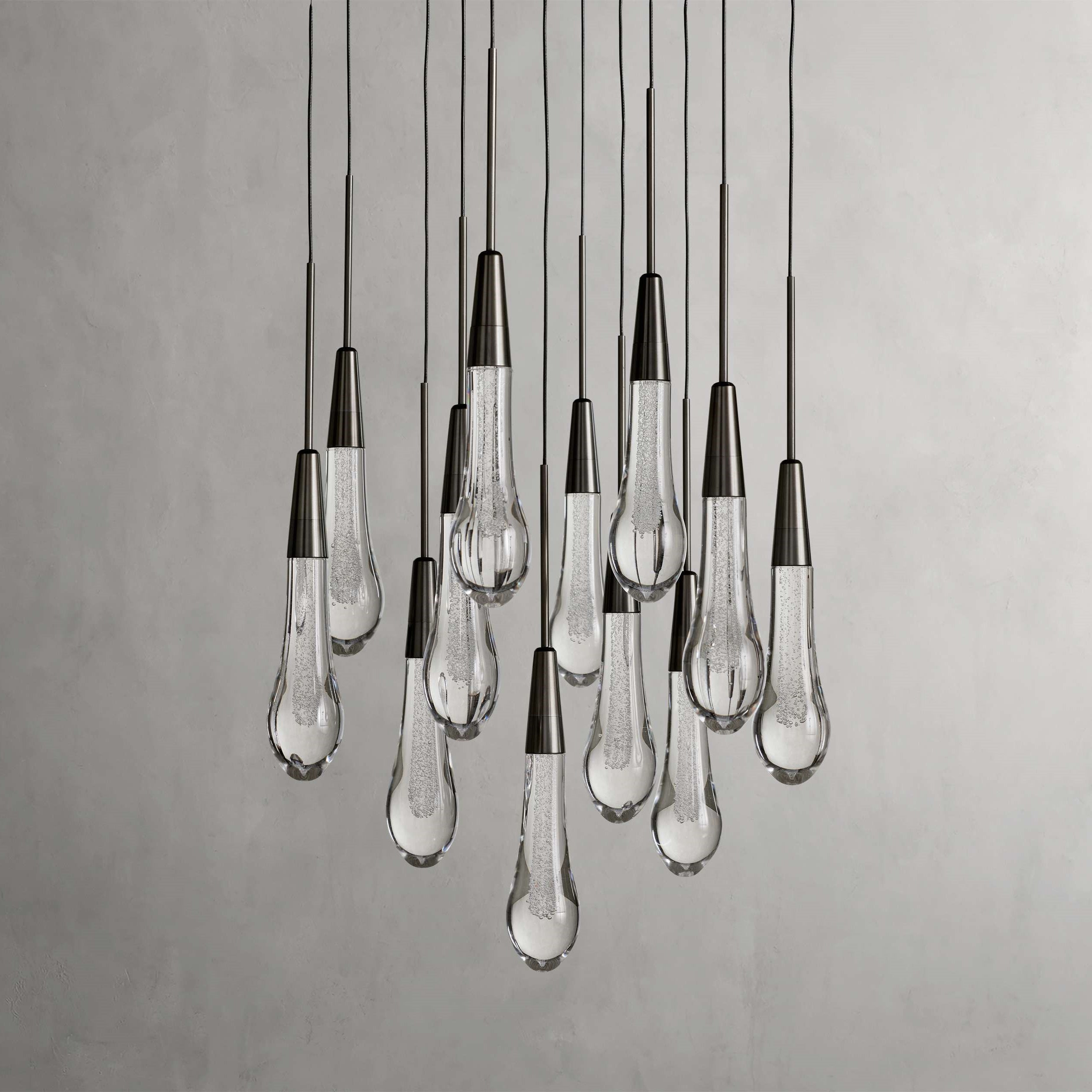 https://cdn.shopify.com/s/files/1/0736/8795/7790/files/solitaire-modern-17-24-36-58-round-chandelier-lighting-merlin-lamps-3.jpg?v=1765374430