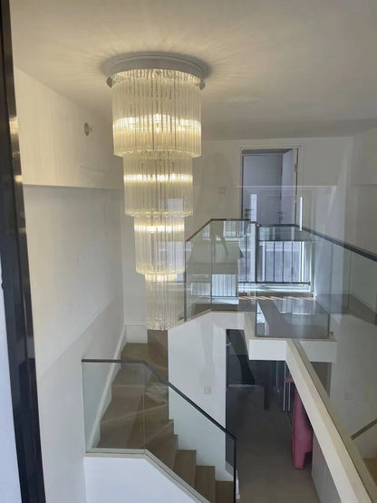 luxury, extra large, oversized,crystal, flush mount chandeliers, high-ceiling space,staircase, grand living room, duplex, luxurious 2-floor loft, entryway, deluxe, foyer and hotel lobby.