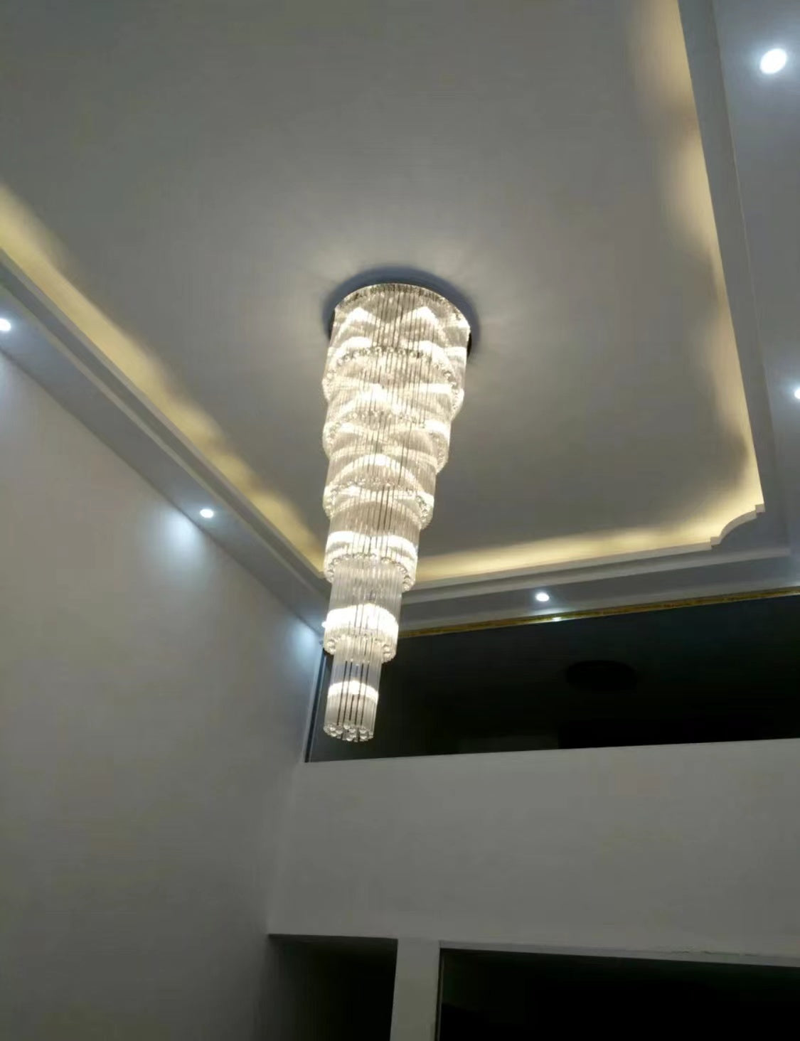 luxury, extra large, oversized,crystal, flush mount chandeliers, high-ceiling space,staircase, grand living room, duplex, luxurious 2-floor loft, entryway, deluxe, foyer and hotel lobby.