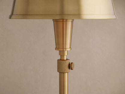 Golden brass Candice Table Lamp close-up. Bell-shaped shade, slender stem, and ribbed rotary on/off switch.