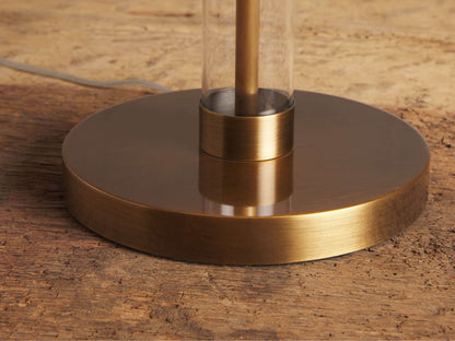 Glass Column Table Lamp base. Round, brushed bronze base on rustic wood. Clear glass column holds a brass rod.