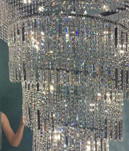 https://cdn.shopify.com/s/files/1/0554/8562/8591/files/Modern_Crystal_Tassel_Chandelier_For_Foyer_Staircase_2.png?v=1775619528