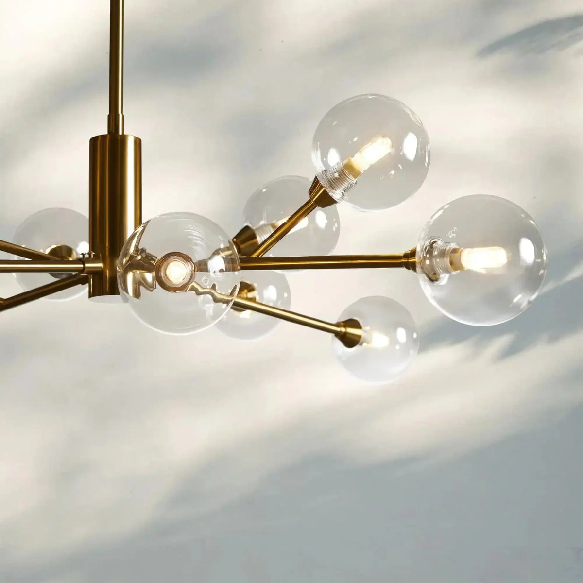 Apollo Round Midcentury Modern Starburst Chandelier in Antiqued Finishes