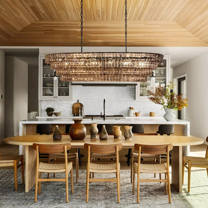 https://cdn.shopify.com/s/files/1/0736/8795/7790/files/ghiaccio-glass-oval-chandelier-5465-merlin-lamps.webp?v=1765380211
