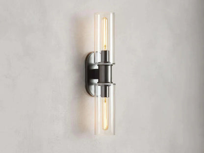 https://cdn.shopify.com/s/files/1/0736/8795/7790/files/harlin-2-light-wall-sconce-in-clear-merlin-lamps-4.webp?v=1765408717