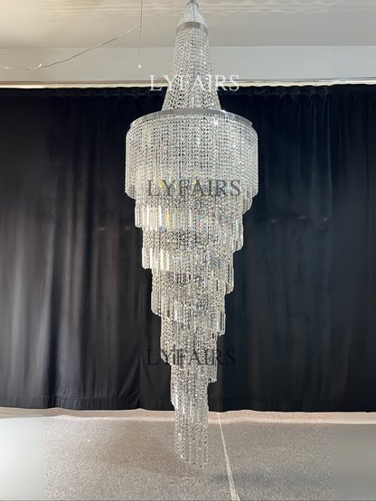 https://cdn.shopify.com/s/files/1/0554/8562/8591/files/lyfairsModernCrystalTasselChandelierforFoyerStaircase_2.png?v=1775619528