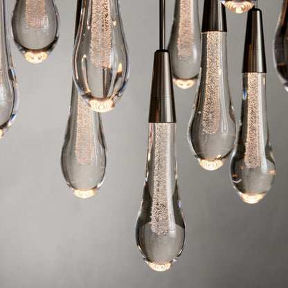 https://cdn.shopify.com/s/files/1/0736/8795/7790/files/solitaire-modern-17-24-36-58-round-chandelier-lighting-merlin-lamps-32.jpg?v=1765374485