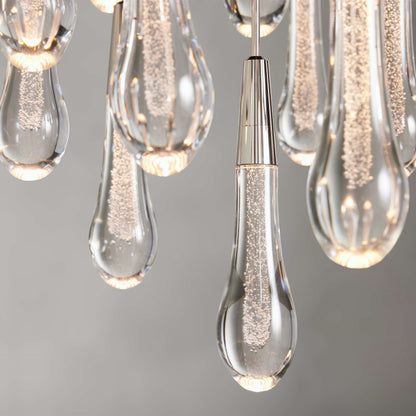 https://cdn.shopify.com/s/files/1/0736/8795/7790/files/solitaire-modern-17-24-36-58-round-chandelier-lighting-merlin-lamps-35.jpg?v=1765374492